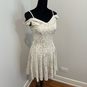 Francesca‘s size small fit and flare dress in cream with white details